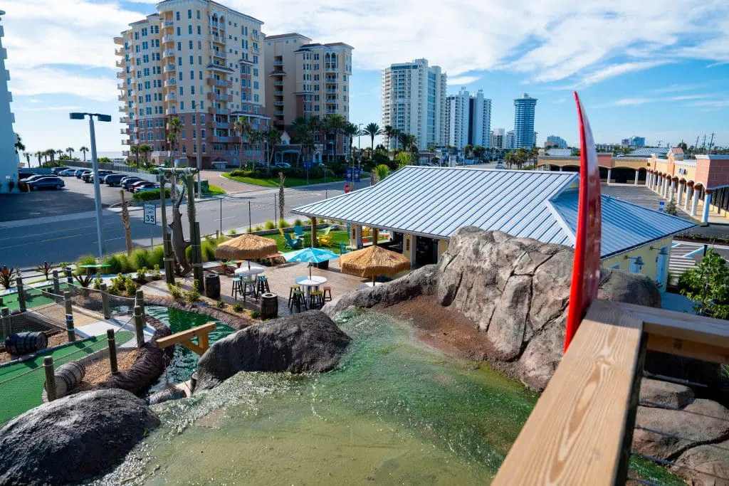 mini golf course with hotels in the background
