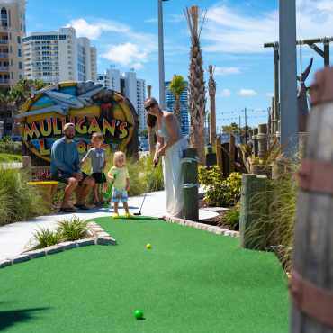 mini golf course with a family
