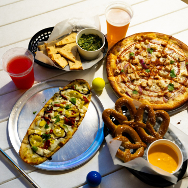 Pizza, pretzels, drinks, and mini golf clubs